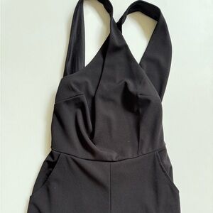 Sleek Black Romper with Cross-Back Straps and Fitted Bodice